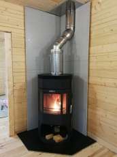 Недорогой камин с отделкой шамотом Сибирь 12 фото в интерьере в Слуцке