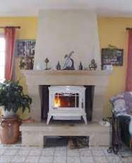 Печь-камин чугунный Invicta Bradford в интерьере Амазонка бай фото в Слуцке