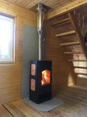 Популярный камин с дровницей Сибирь 8 в интерьере фото в Слуцке
