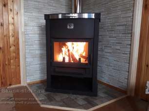 Стальной недорогой камин Теплодар ОВ-120 (угловой) фото в интерьере в Слуцке