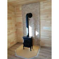 Чугунный камин со стеклом Сибирь 7 фото в интерьере в Слуцке