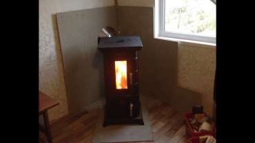 Отопительная печь Термофор Статика Тетра, чёрная бронза фото в интерьере в Слуцке