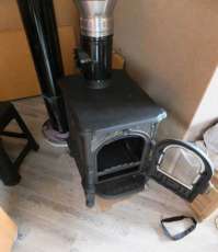 Недорогой печь-камин со стеклом Сибирь 6 фото в интерьере в Слуцке