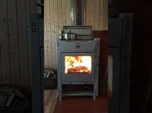 Стальной камин со стеклом Теплодар Кадриль фото в интерьере в Слуцке