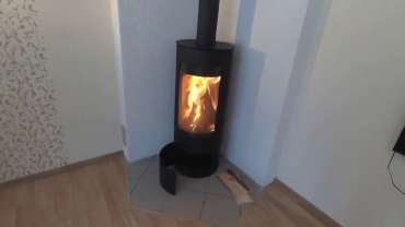 Стильная печь-камин с шамотом Мета-Бел Селигер в Слуцке фото в интерьере в Слуцке