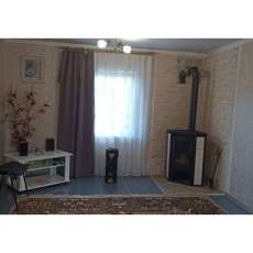 Стальной камин с шамотом Мета-Бел Ритм L фото в интерьере в Слуцке