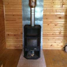 Печь-камин с шамотом Мета-Бел Ангара-Аква в интерьере фото в Слуцке