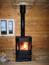 Печь-камин Бавария водяной с плитой в интерьере в Слуцке