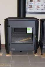 Печь-камин чугунный Invicta Carolo в интерьере Амазонка бай фото  в Слуцке