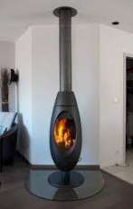 Печь-камин чугунный Invicta Ove в интерьере Амазонка бай фото в Слуцке