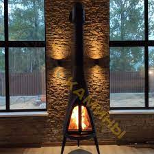 Печь-камин чугунный Invicta Pow-Wow в интерьере Амазонка бай фото в Слуцке